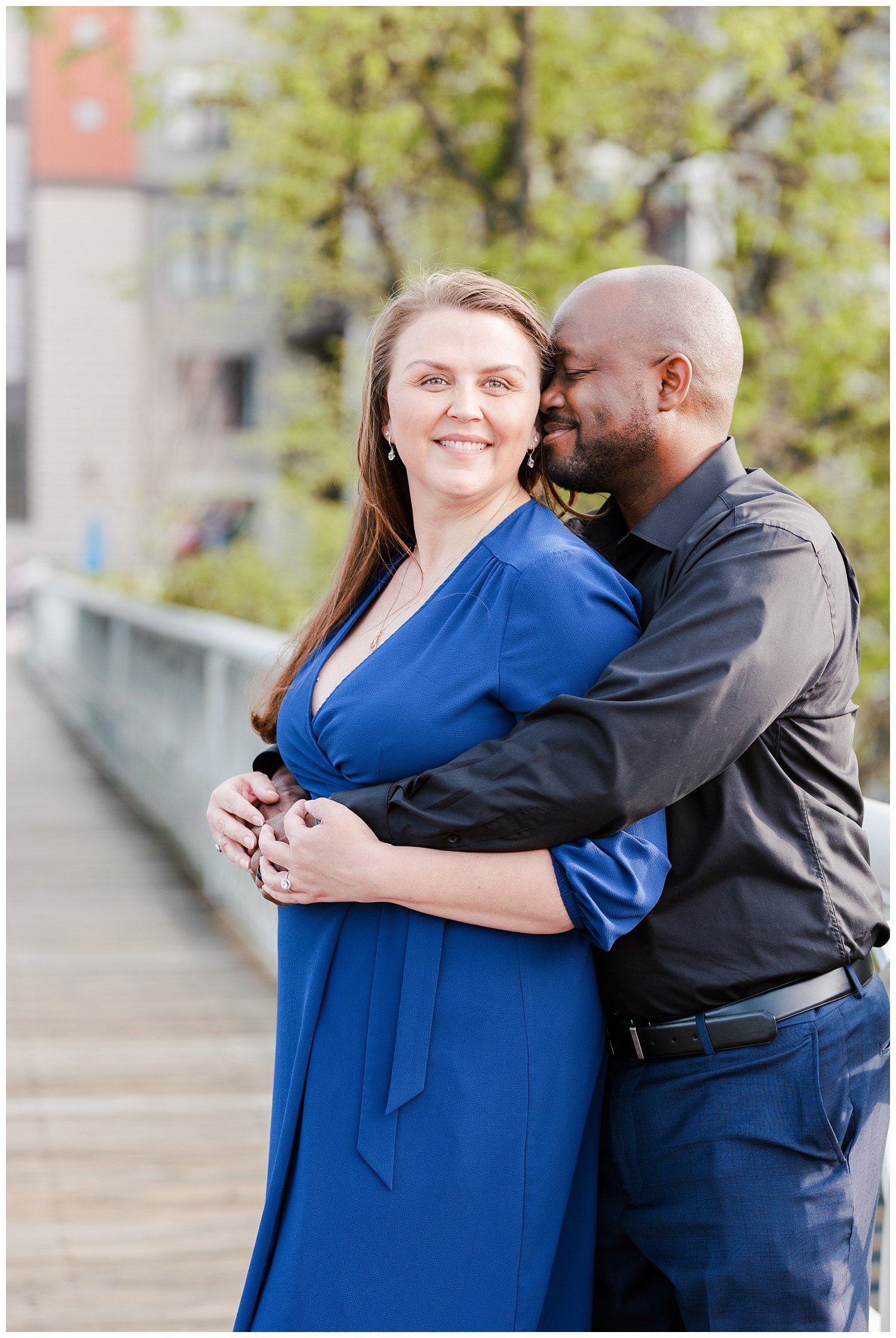engaged couple posing on the Walnut Street Bridge in Chattanooga
