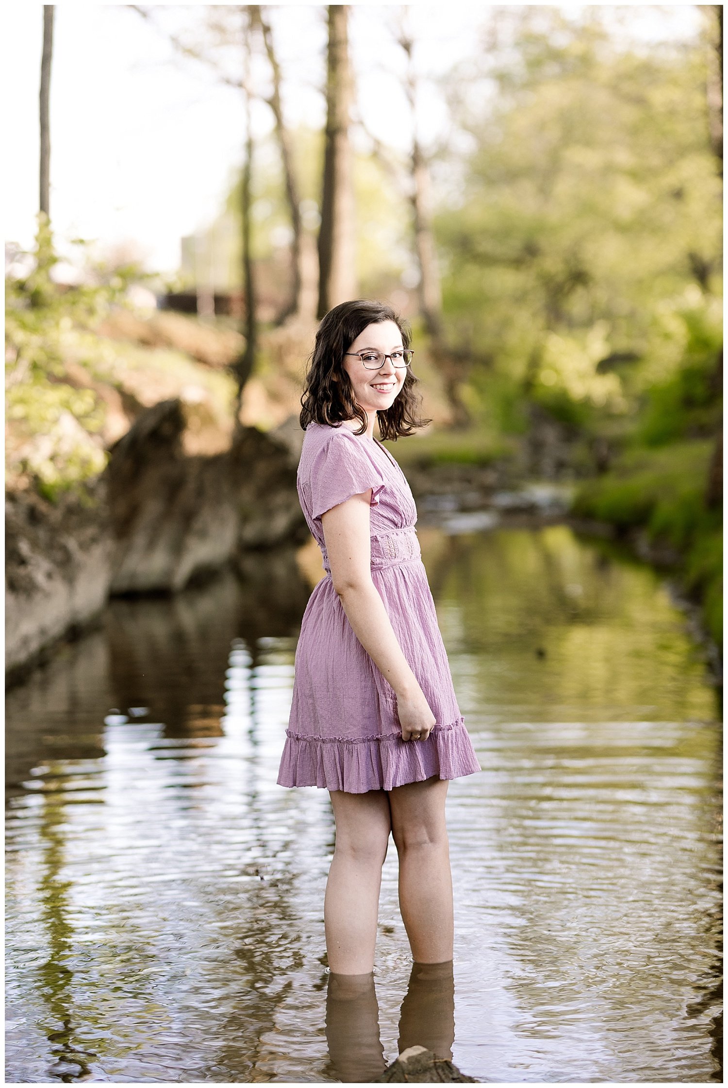 college senior standing in the stream at Lee University