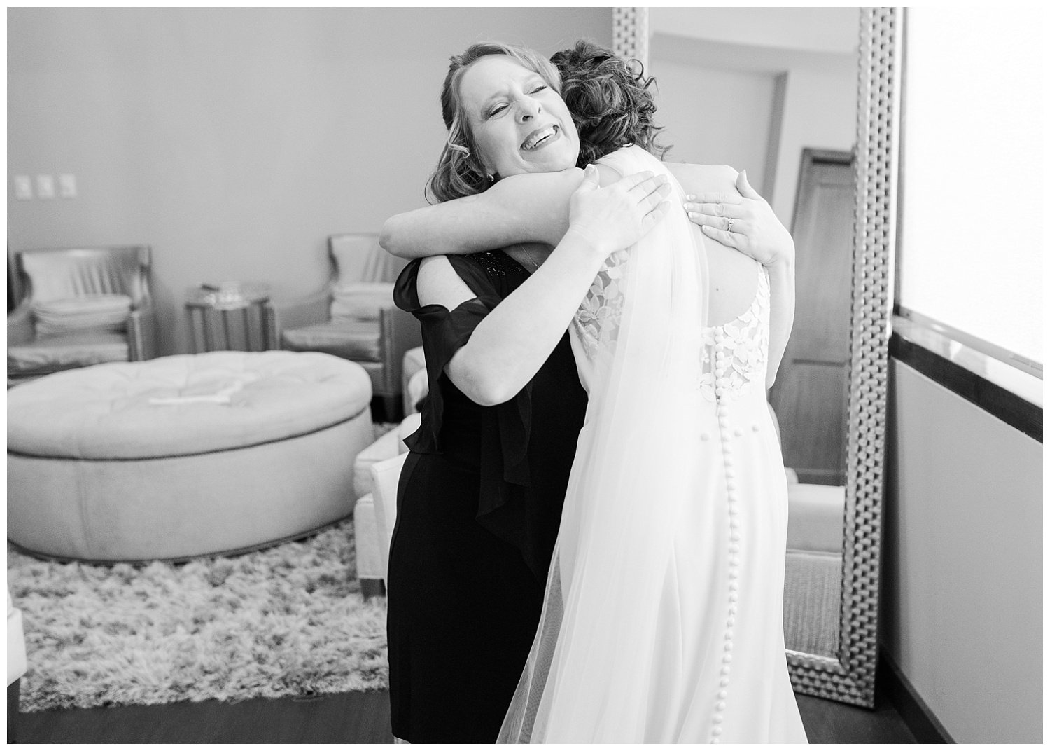black and white photo of bride hugging her mom