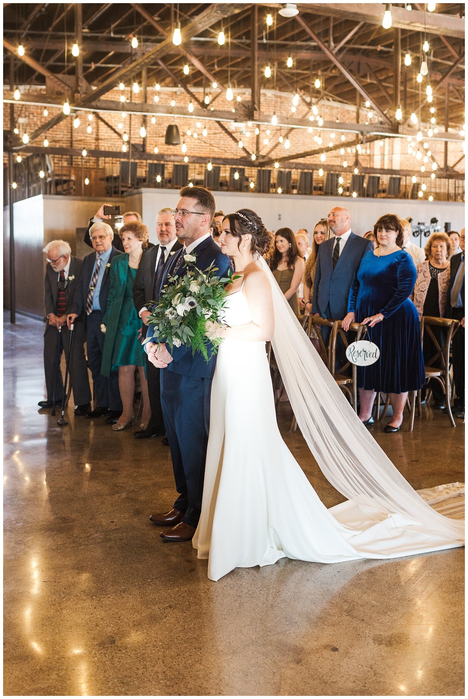 bride walking down the aisle with her dad at knoxville wedding venue