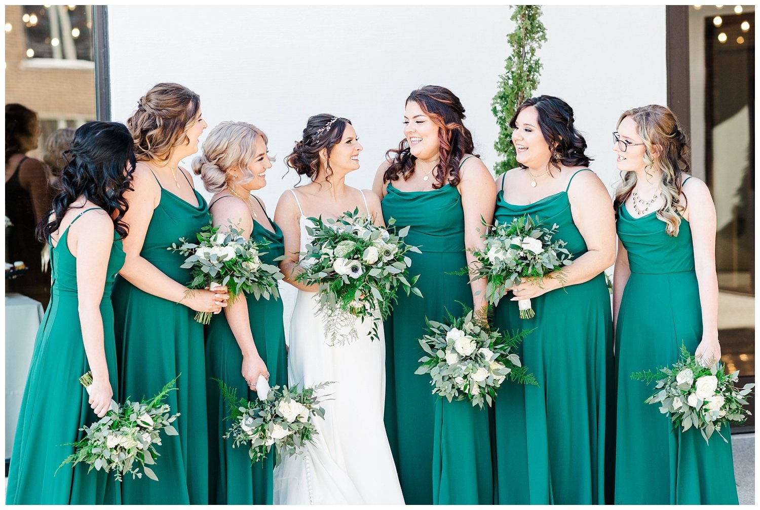 bride and bridesmaids looking at each other at knoxville wedding venue