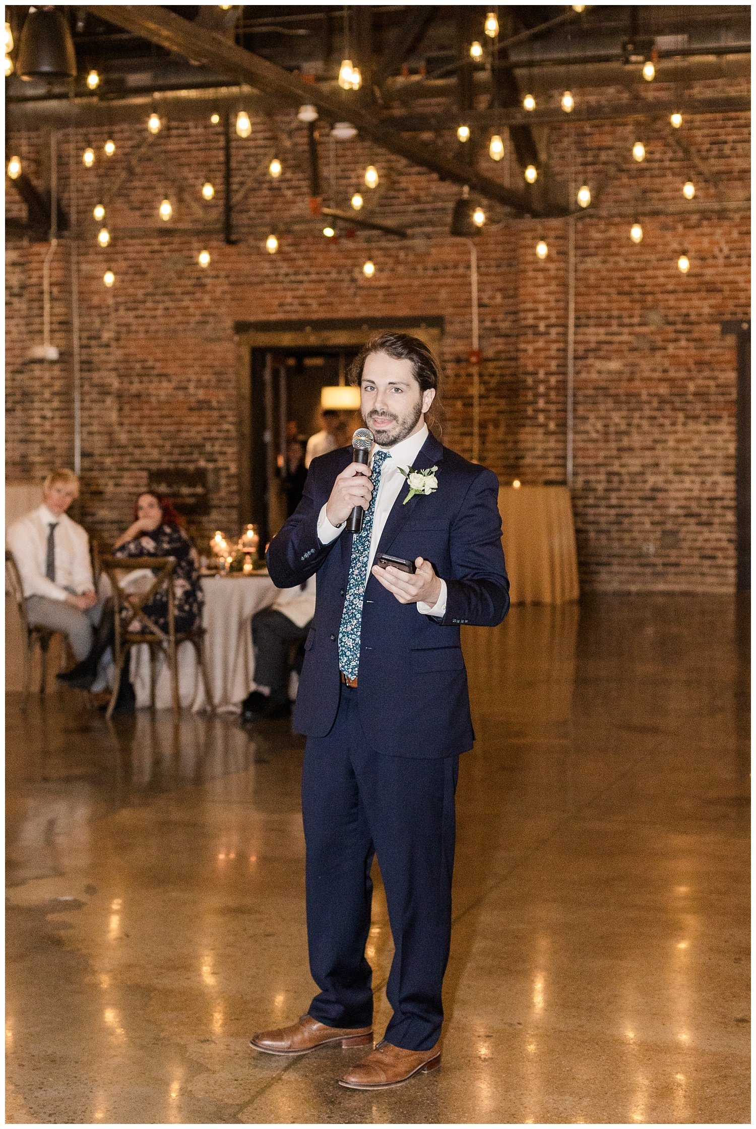 best man giving his toast at wedding reception