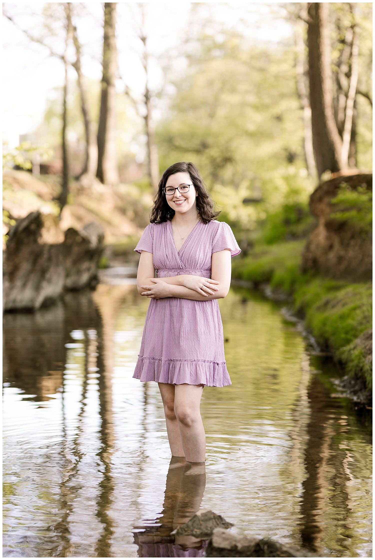 college senior standing in the stream at Lee University