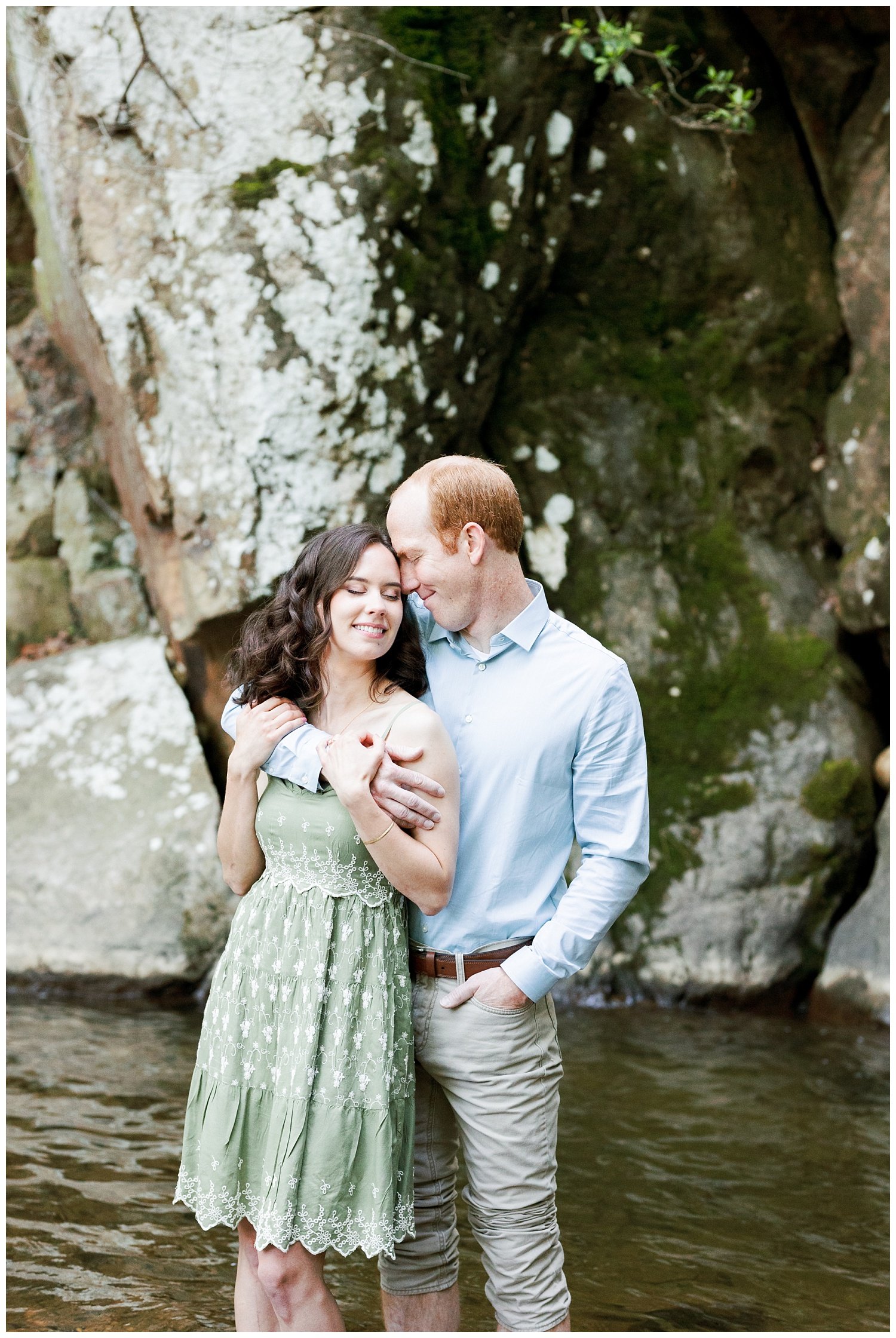 couple holding each other during engagement photos at Glen Falls 
