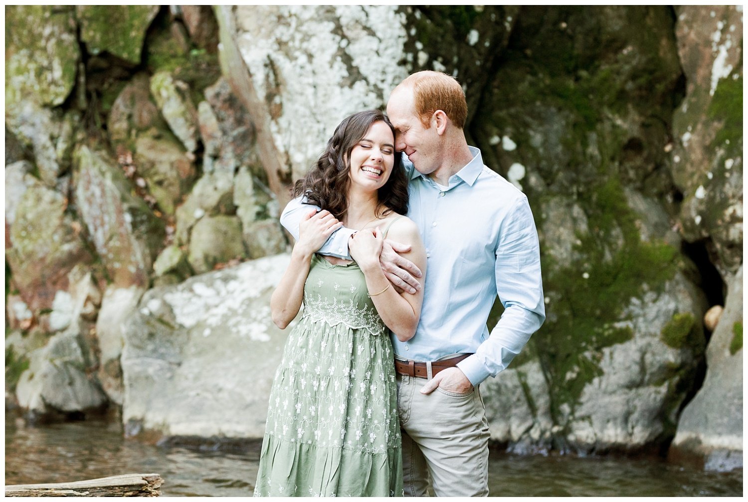 couple standing in waterfall for engagement session in Chattanooga