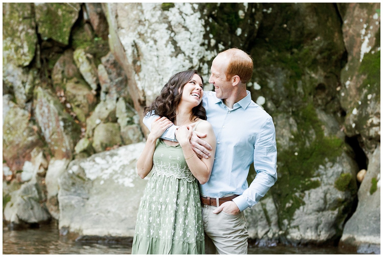 couple smiling at each other during engagement session at Glen Falls