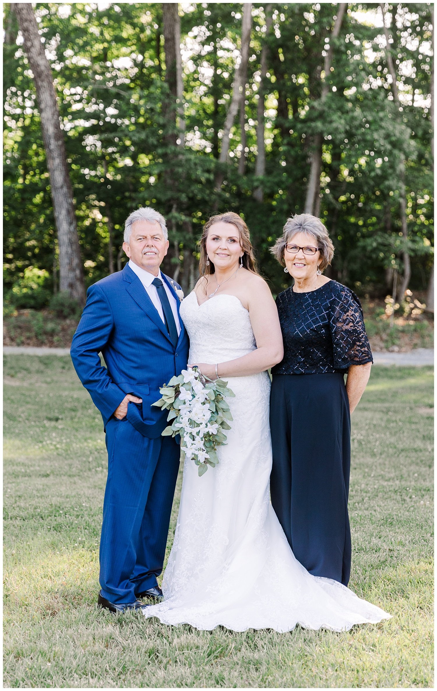 bride posing with parents at Mountain Heights Venue