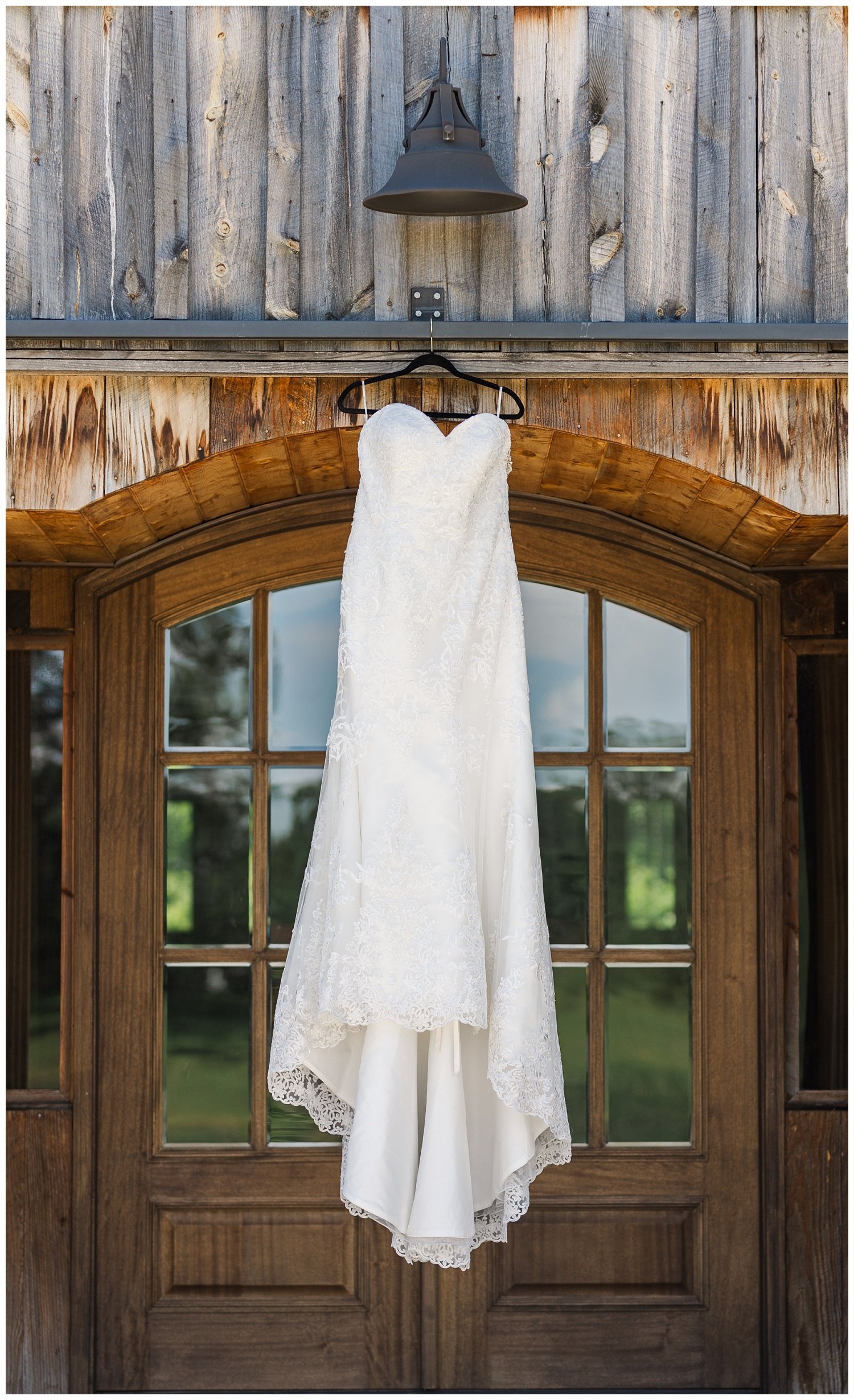 wedding dress hanging from the front door at Mountain Heights Venue