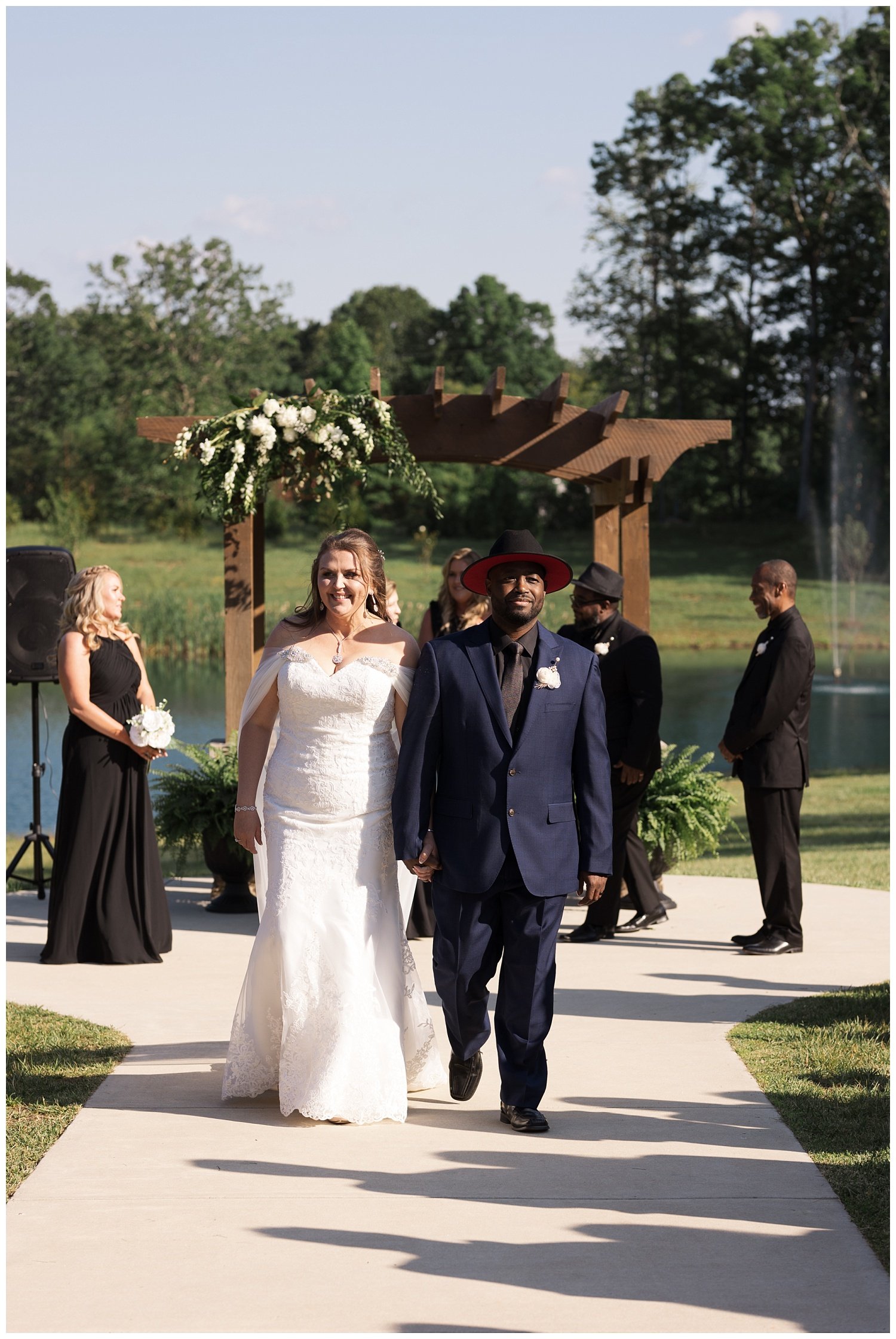 bride and groom walking back down the aisle at Mountain Heights Venue