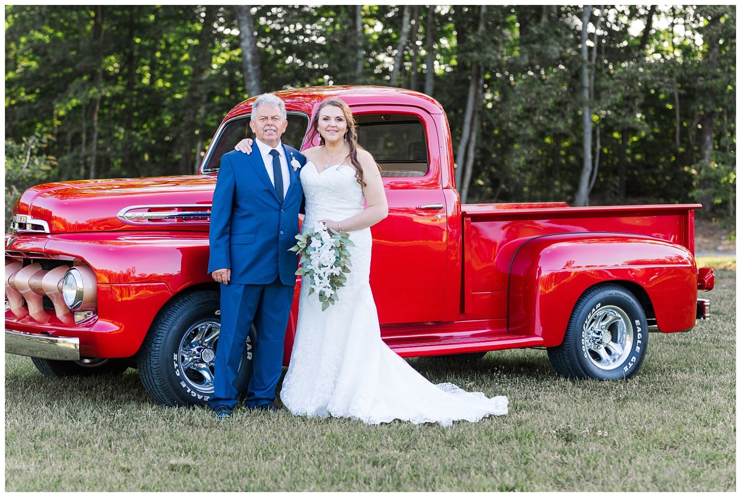 bride and dad posing in front of red truck