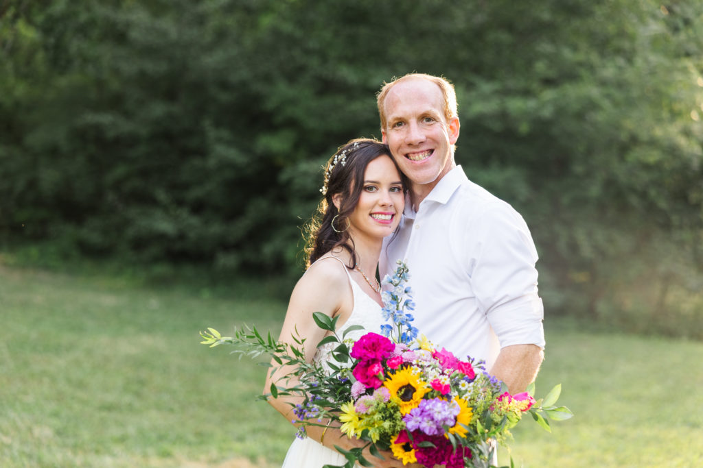 bride and groom posing for photos at golden hour at Chattanooga wedding