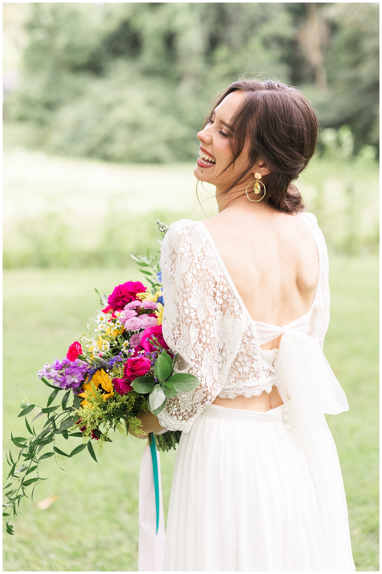 bride laughing and holding her bouquet at Chattanooga wedding
