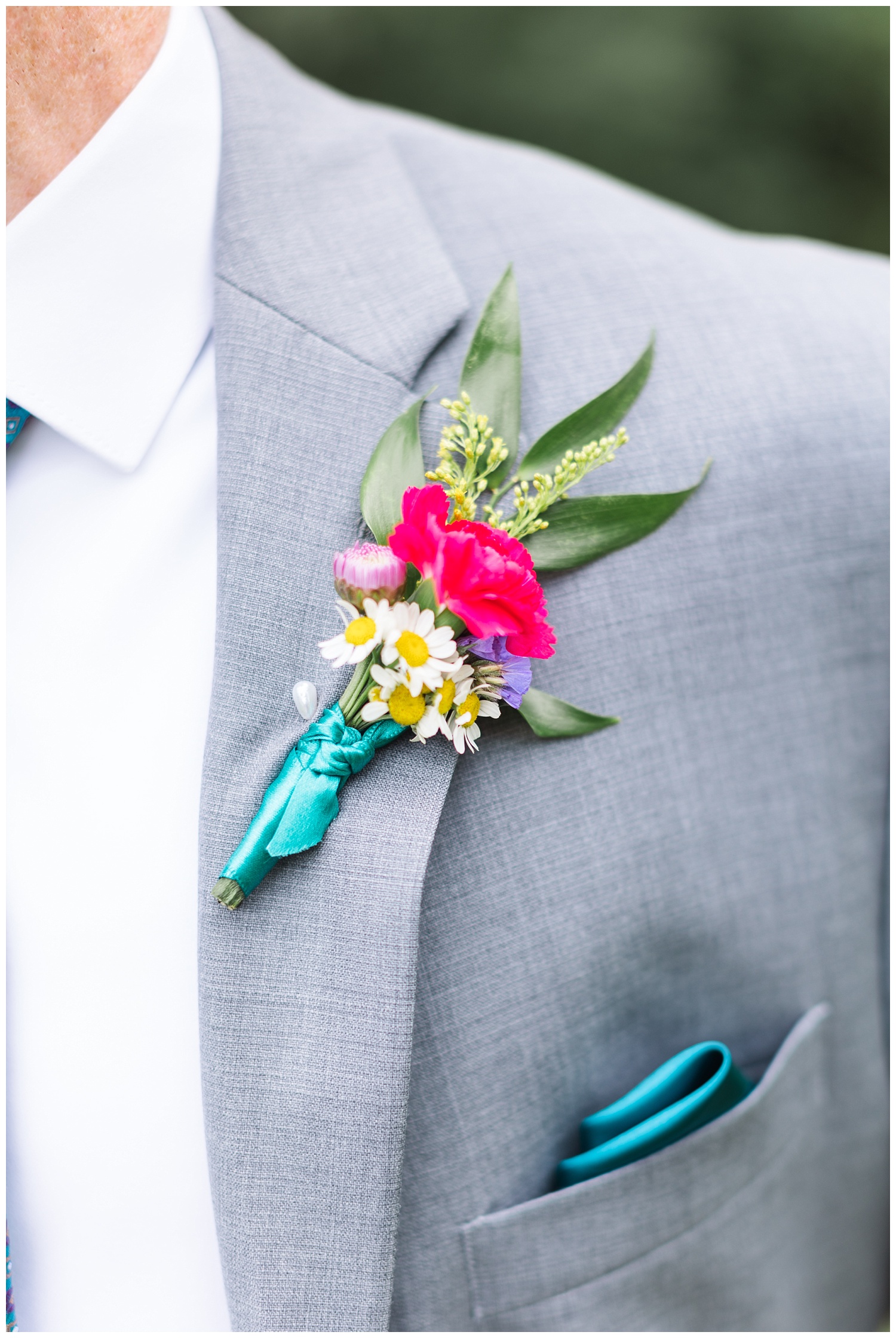 close up detail of the groom's boutonniere 