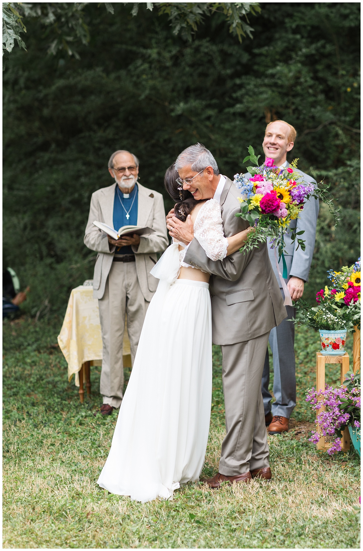 dad hugging bride at the altar before giving her away