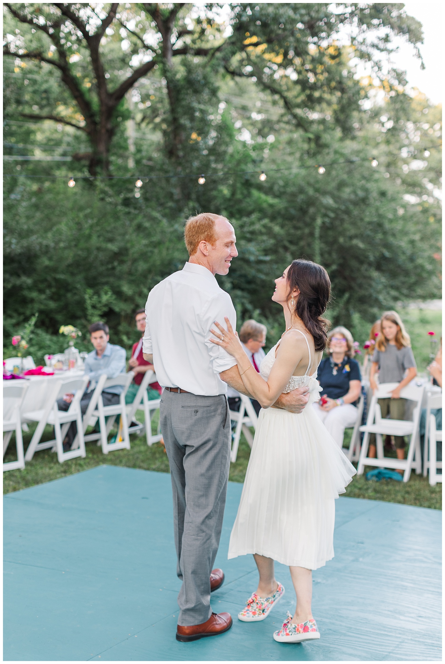 bride and groom's first dance at outdoor wedding reception