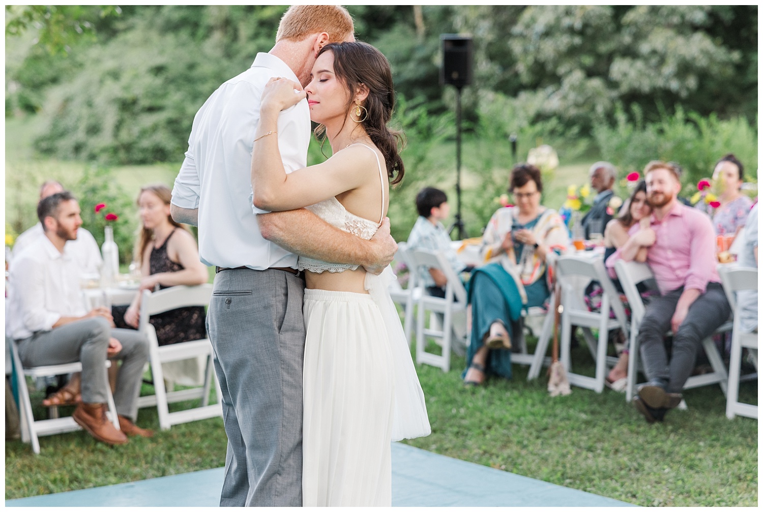 bride and groom's first dance at outdoor wedding reception