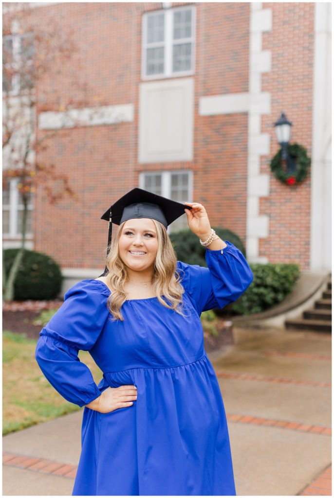 college senior holding her cap during graduation photos in Cleveland, TN