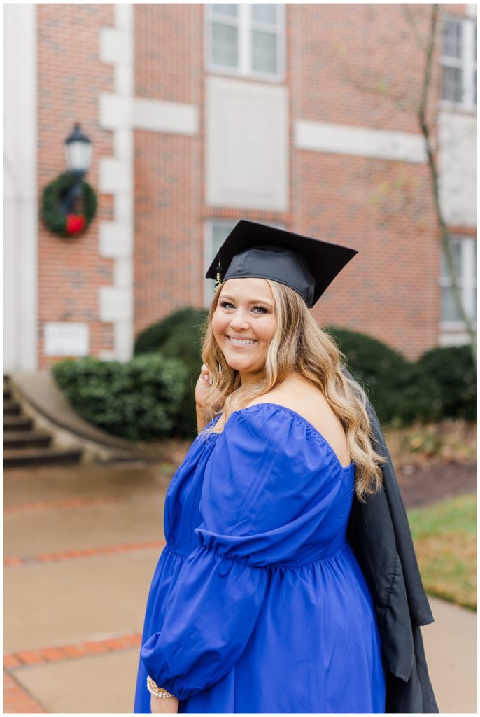 college senior wearing her cap and gown for graduation photos in Cleveland, TN
