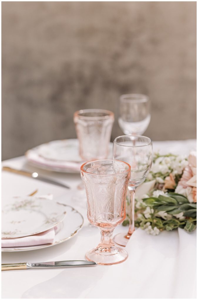 pink glassware and place settings at wedding styled shoot