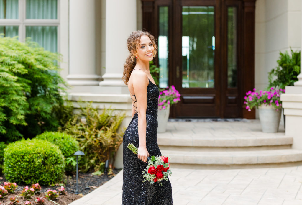 high school senior posing in black prom dress in Chattanooga 