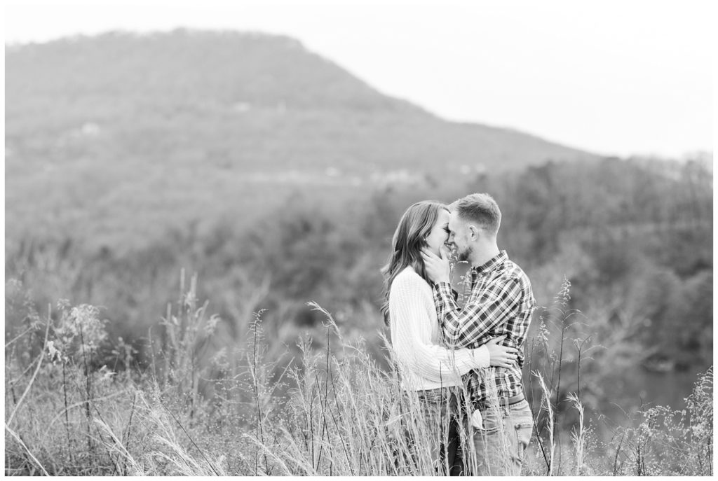 engaged couple kissing for photos at winter engagement session