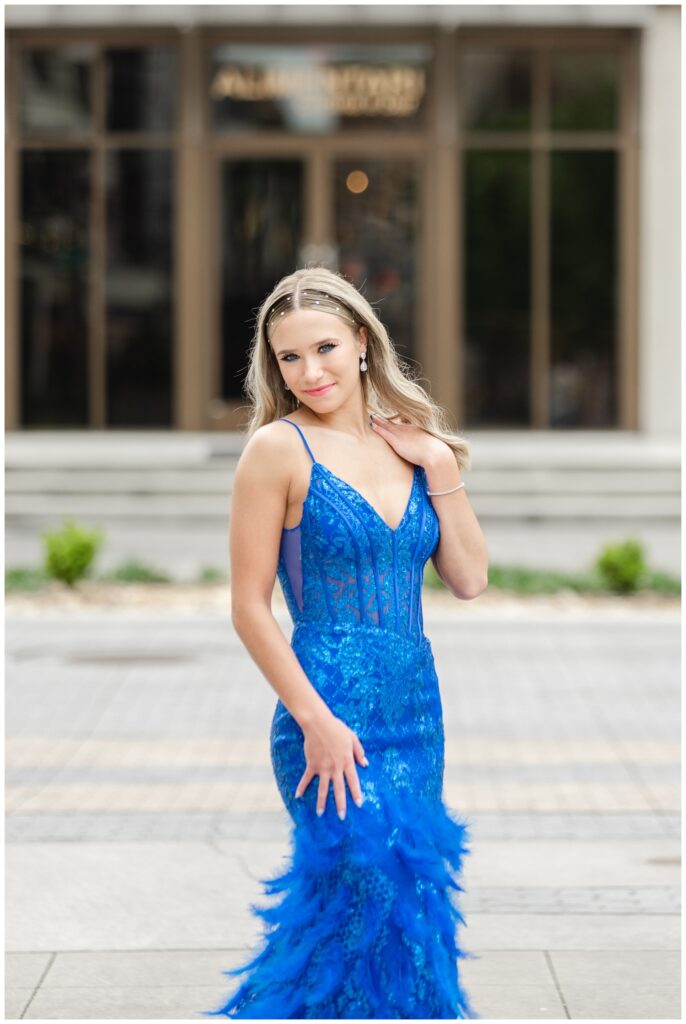 girl posing for prom photos in front of the Westin hotel in Chattanooga