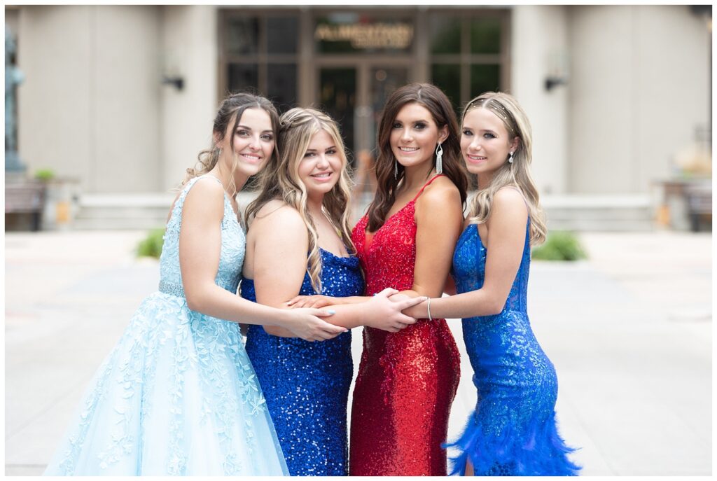high school senior girls holding arms for Chattanooga prom pictures