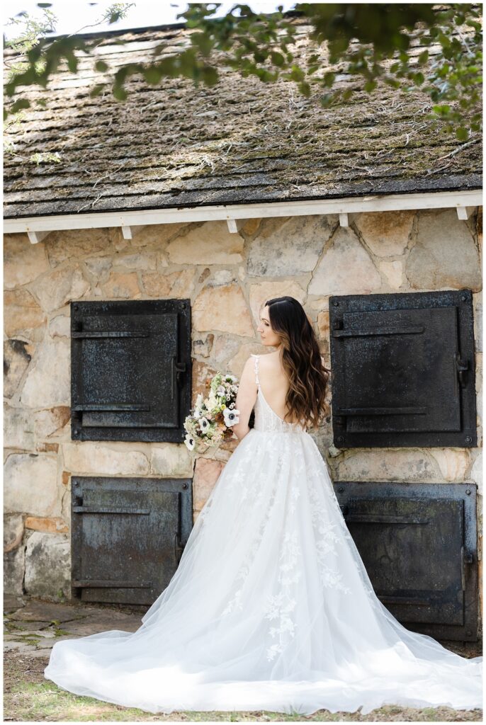 full shot of back of bride's wedding dress at venue