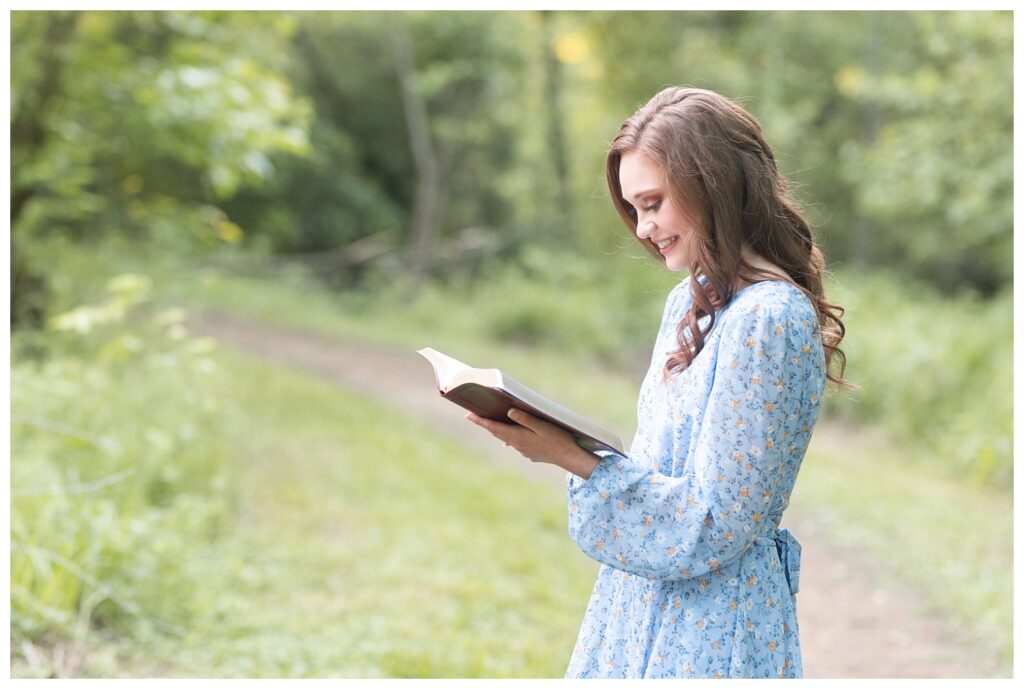 high school senior reading her bible in Renaissance Park