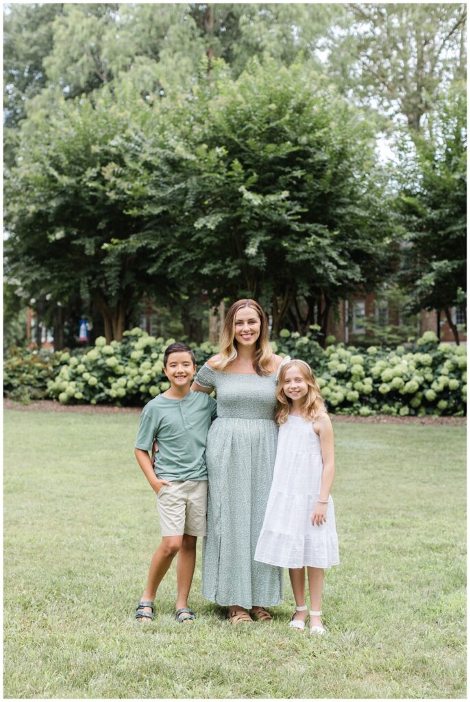 mom standing with her kids in front of trees in Cleveland, Tennessee
