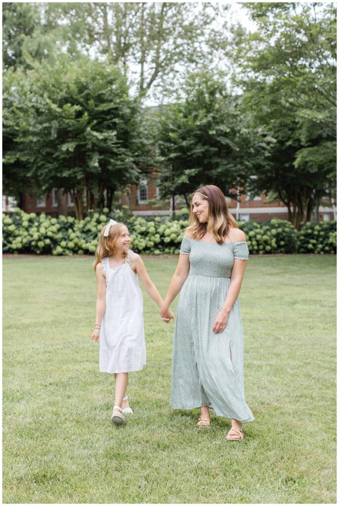 mom and daughter holding hands at photo session in Cleveland