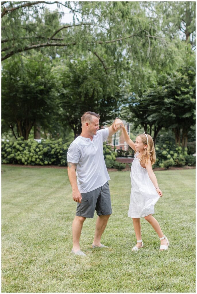dad twirling his daughter at family session in Cleveland, TN