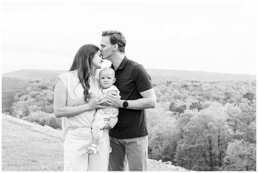 couple holding their one year old daughter at Raccoon Mountain family session