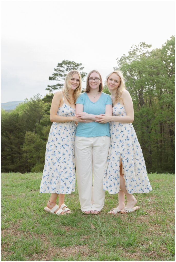 three sisters hugging each other during family session on Racoon Mountain