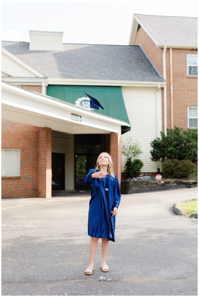 5th grade girl throwing her cap in the air at Chattanooga mini session