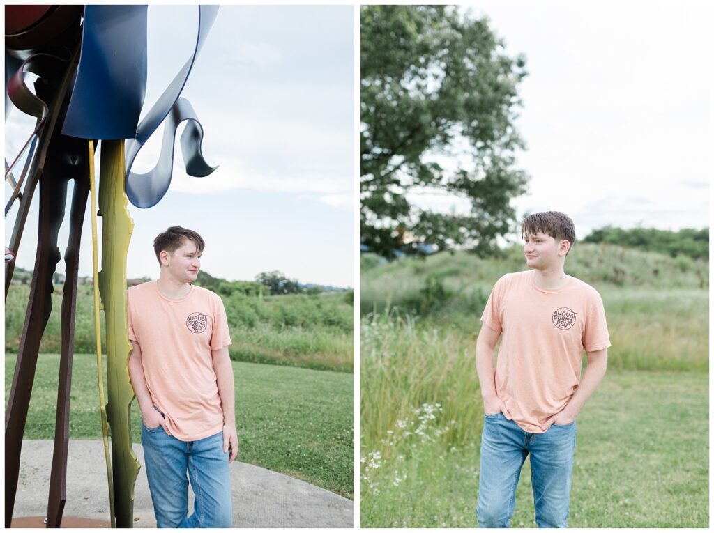 boy leaning against a sculpture near a field at Chattanooga senior photoshoot