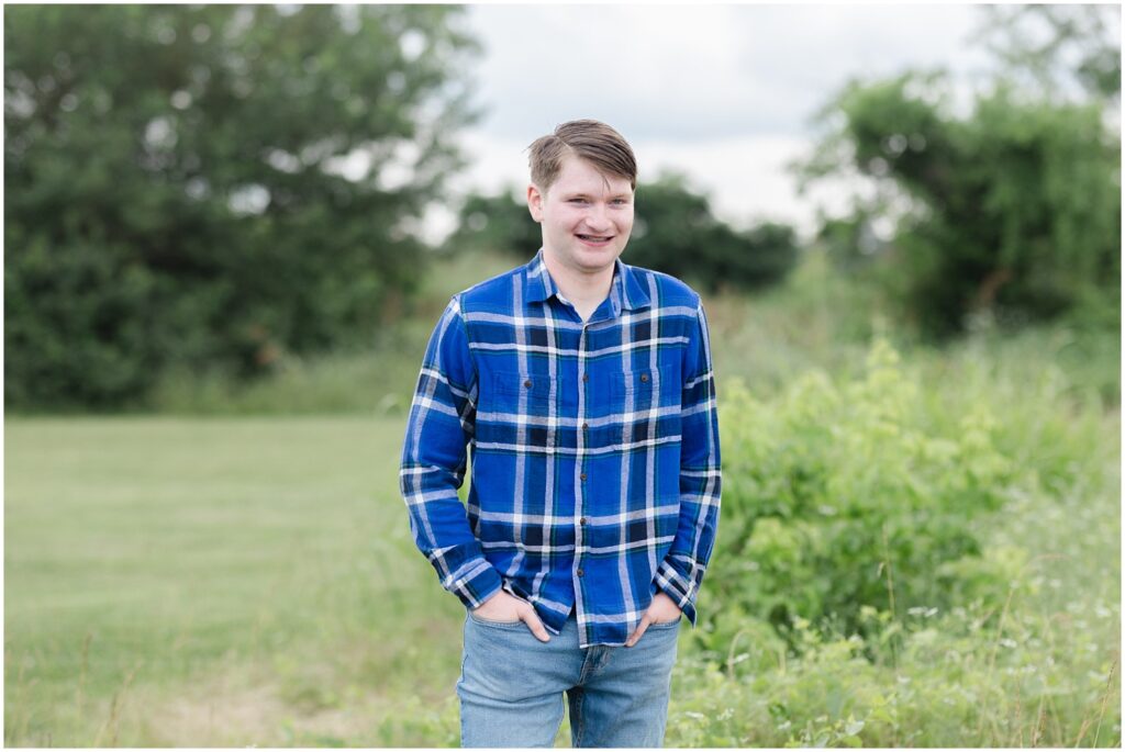 senior boy wearing a blue and white striped shirt for Chattanooga session