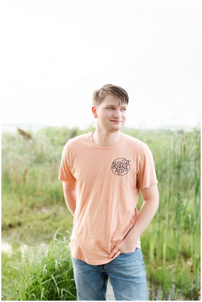 high school senior wearing an orange shirt at Chattanooga portrait session