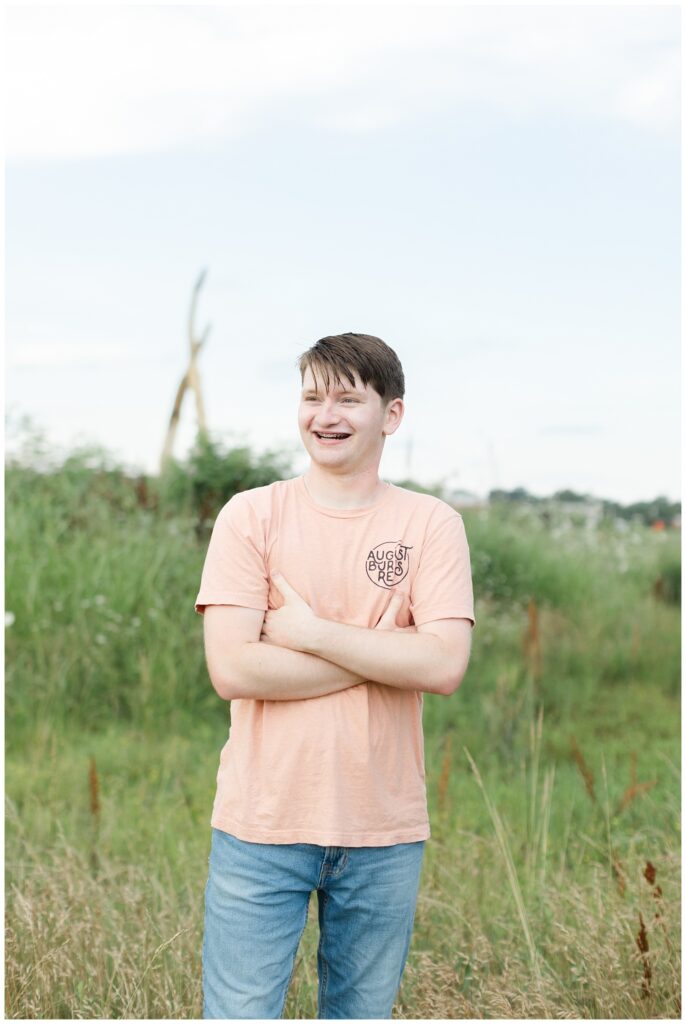 high school senior wearing an orange shirt at Chattanooga portrait session