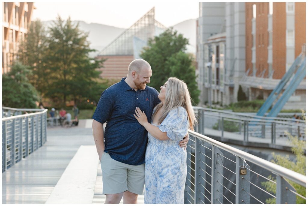 couple holding each other and smiling near the Walnut Street Bridge