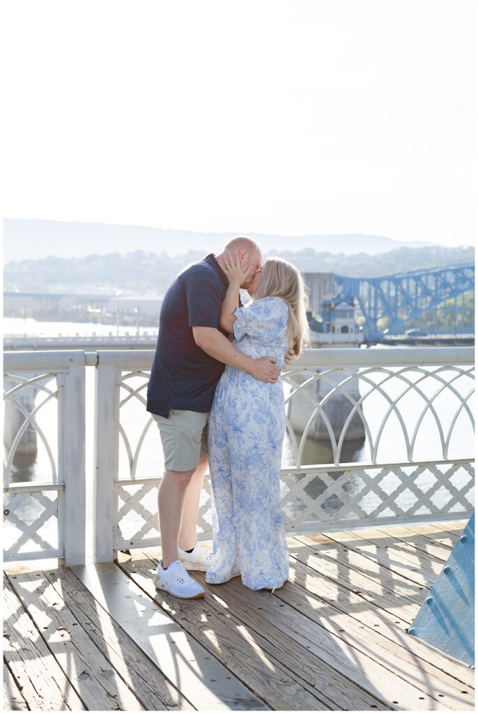 engagement couple sharing a kiss after proposal on the Walnut Street Bridge