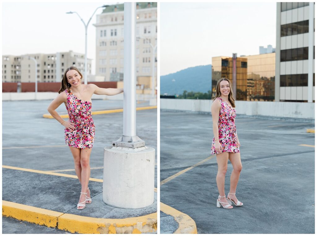 senior holding onto a light pole and smiling at Chattanooga photoshoot