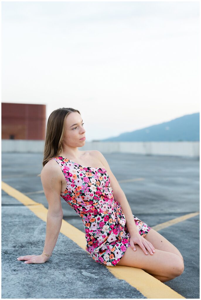 Chattanooga senior girl sitting on a curb on top of a parking garage