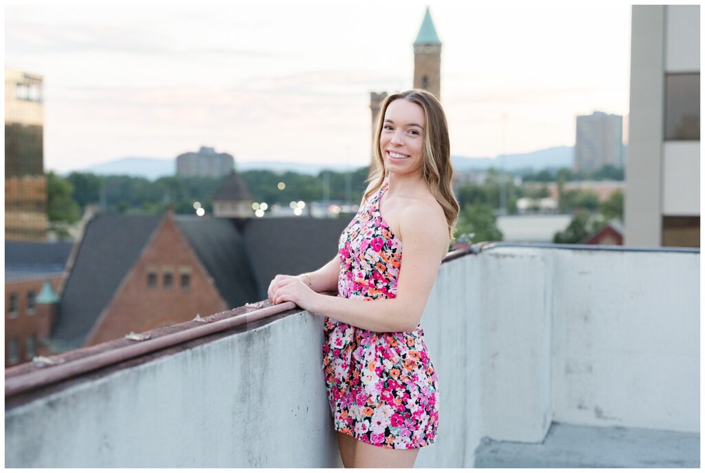 high school senior girl posing on top of garage in downtown Chattanooga