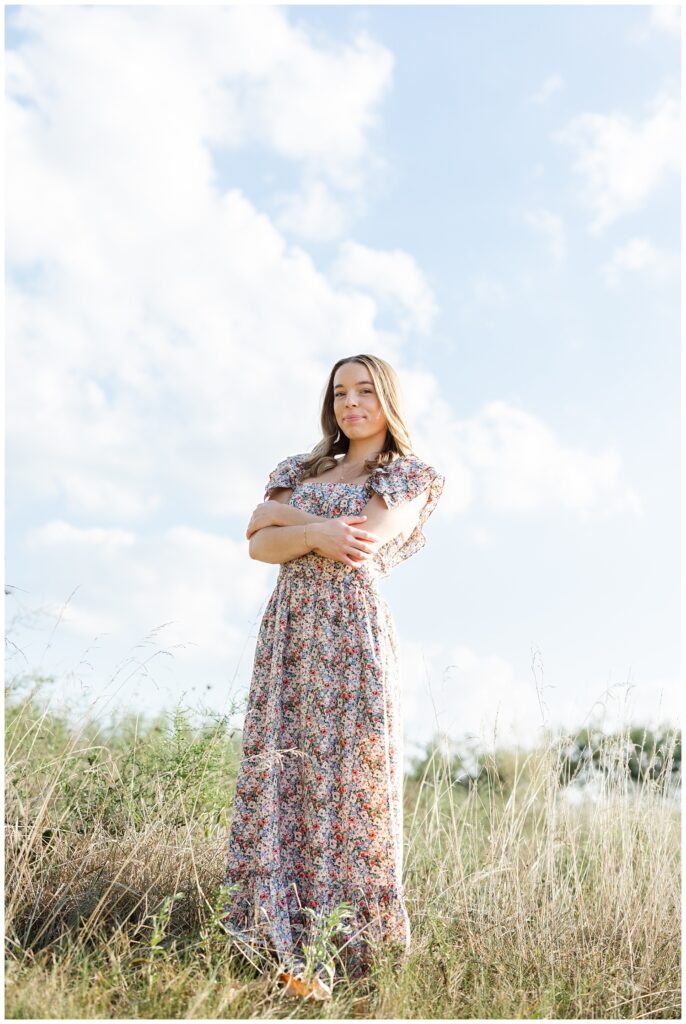 high school senior posing in a field at Chattanooga portrait session