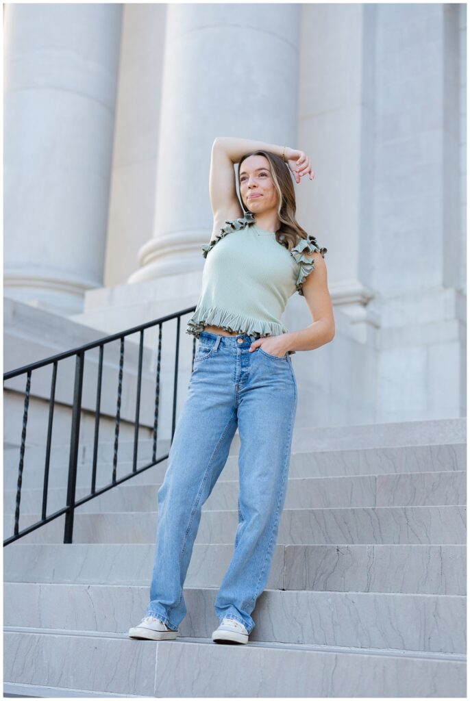 senior girl posing on the steps of the Chattanooga courthouse downtown