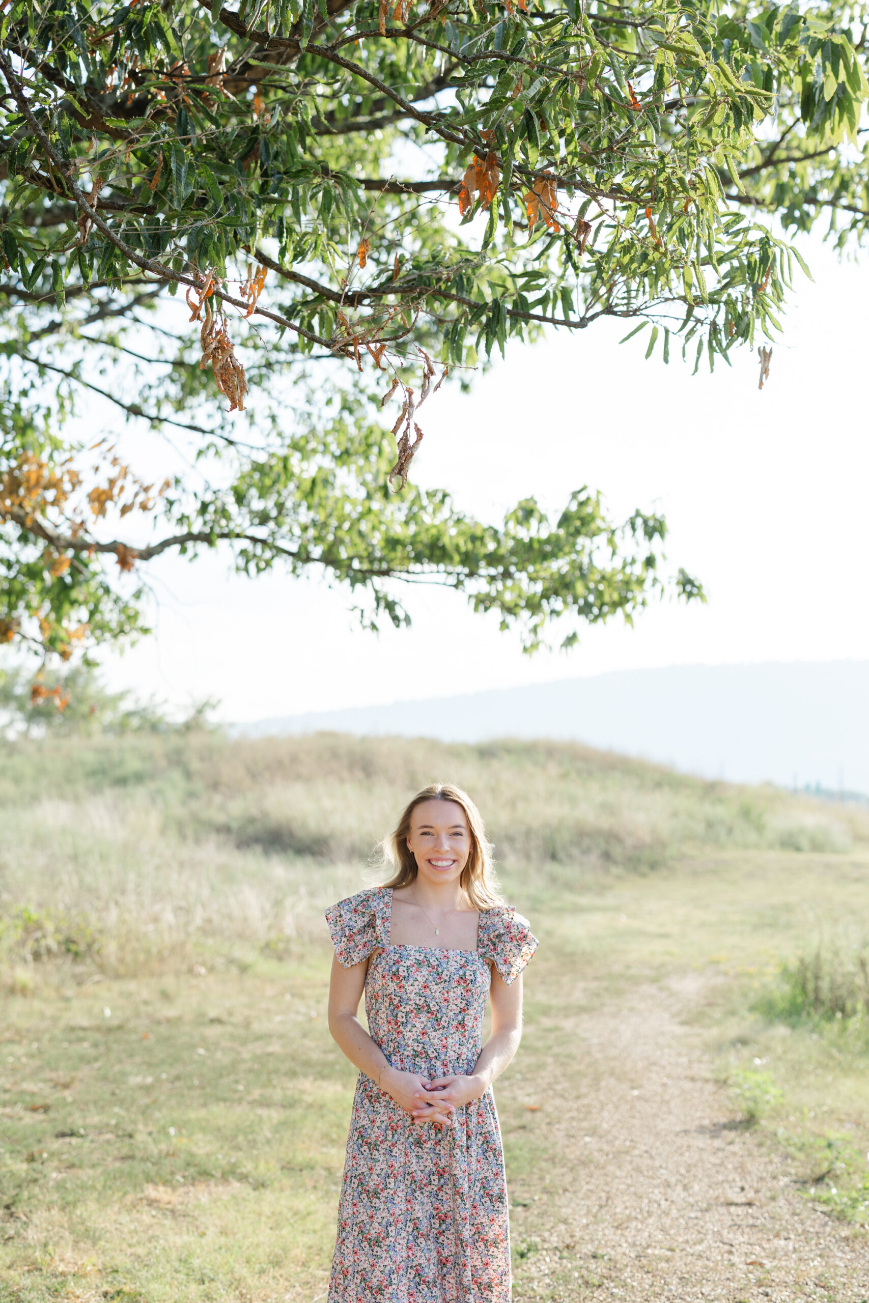 Chattanooga high school senior standing under a tree