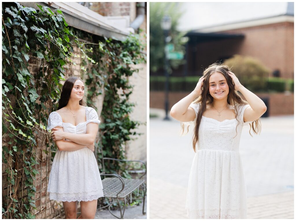 girl holding her hands in her hair while posing on the corner of the street 