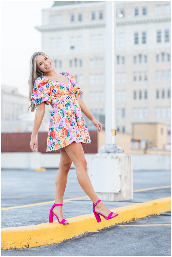 senior session on a parking garage rooftop in downtown Chattanooga at golden hour 