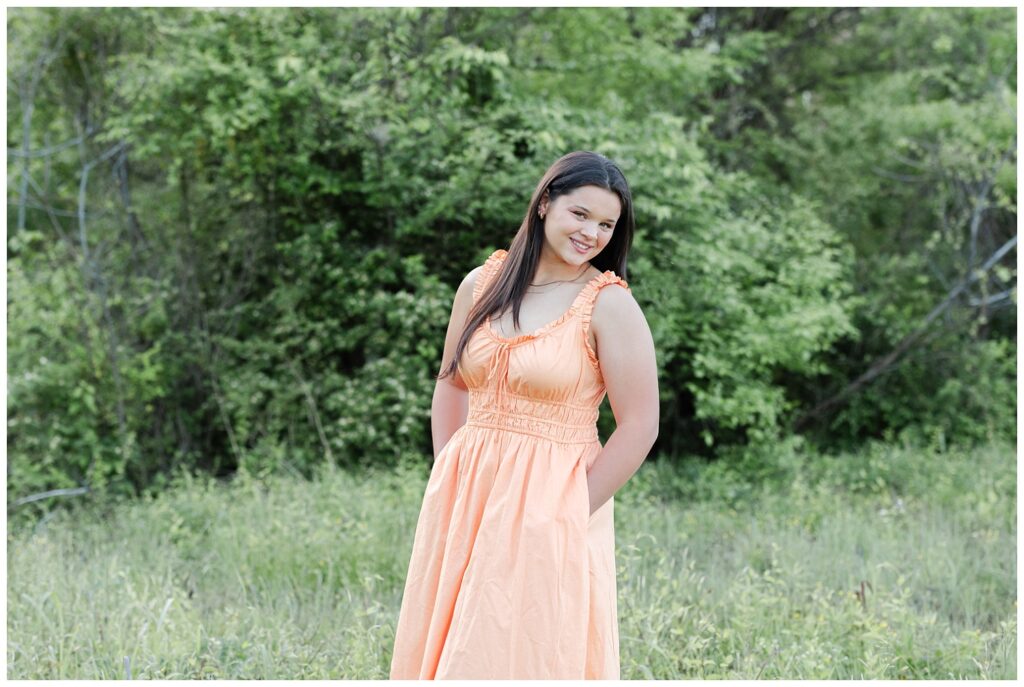 high school senior posing in the grass at Renaissance Park in Chattanooga